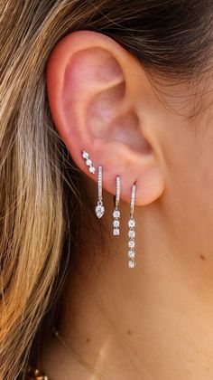 This earring features diamonds set in 14KT Gold. Hoop measures 10mm Sold as a single Silver Earring Stack Prom, Prom Earring Stack, Prom Jewlrey Looks, Silver Dangle Earrings For Prom, Silver Jewelry Prom, Prom Jewelry Ideas, Gold Dangle Earrings Prom, Prom Jewelry Silver, Silver Prom Earrings