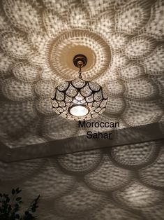 the moroccan sahara ceiling light is lit up