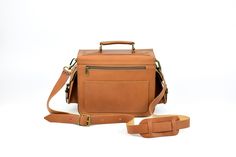 "LeatherStrata's camera bag is a compact and rugged bag that can hold a DSLR and up to 2 additional lenses. It is a premium quality full-grain leather camera bag for men or women that can be used in three ways: carry-on handbag, shoulder bag, or your everyday camera bag. This rugged photography bag will last for many years. It comes in 6 colors! These bags are designed to impress whilst keeping all of your best photography gear well protected. * DETAILS: ✓ Durable top handle with metal loops ✓ 2 Rectangular Camera Bag For Outdoor Use, Outdoor Camera Bag With Rectangular Shape, Rectangular Camera Bag For Outdoor, Brown Rectangular Camera Bag With Removable Pouch, Rectangular Brown Camera Bag For Outdoor, Brown Rectangular Camera Bag For Outdoor, Vintage Rectangular Camera Bag For Daily Use, Outdoor Rectangular Camera Bag With Removable Pouch, Rectangular Adventure Bag