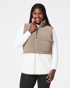 This two-in-one vest helps you brave the chill in style and comfort. On colder days where you need extra warmth and coverage all around, the zip-up long vest option will be your go-to layer. On slightly warmer days, simply remove the bottom fleece portion to reveal a perfectly cropped velour vest that flatters any high-waisted look. With convenient, fleece-lined hand pockets and a shock cord at the hem to define your waist, this fully-lined layer is every bit as flattering as it is versatile. | Spanx Women's Two-In-One Velour Fleece Vest Top Long Vest, Long Vests, Fleece Vest, Vest Top, Cold Day, Zip Up, In Style, Brave, Zip Ups