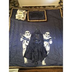 star wars themed quilt with darth vader and stormtroopers on it