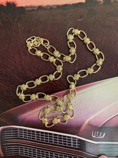 "Givenchy 1980s Gold Link Chain Necklace. This piece is a classic beauty and is of great quality and in great condition. It is 22\" in length. Each link is slightly over 1/2\" in length and 3/8\" in width. Each link has a ridged Plus hugging it. It has a heavy lobster claw closure and a Givenchy signature round tag with the four Gs inside of it. Gorgeous piece to wear alone or to layer with other chains, pearls or necklaces. You will fall in love with this classic Chain necklace. Free Shipping i Gold Link Chain Necklace, Givenchy Jewelry, Round Tags, Gold Link Chain, Gold Link, Link Chain Necklace, Tiffany Heart, Chain Link Necklace, Link Necklace