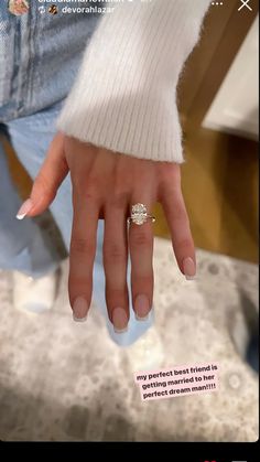 a woman's hand with a ring on it, and the caption says