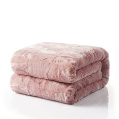 two fluffy pink blankets stacked on top of each other in front of a white background