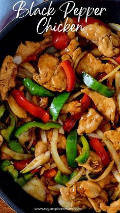 chicken stir fry with peppers and onions in a skillet