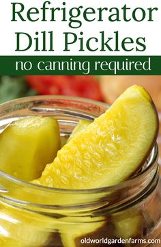 a jar filled with pickles sitting on top of a table