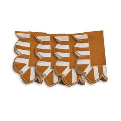 four orange and white striped napkins with ruffled edges on each side, set of five