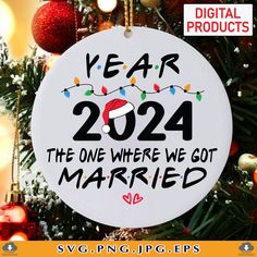 a white ornament hanging from a christmas tree with the words year 2020 and a santa hat on it