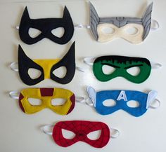 four masks are lined up on a table