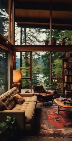 a living room filled with furniture next to a window covered in lots of books and plants