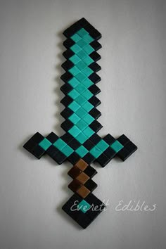 an image of a cross made out of legos on the wall in front of a white background