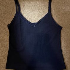 H&M Dark Navy Lacy Tank Top With Bow, Excellent Condition Never Worn. Will Accept Offers For Less, Thanks For Looking! Lacy Crop Tops, Lacy Tank Tops, Blue Seamless V-neck Camisole, Blue V-neck Seamless Camisole, H&m Fitted Cami Tank Top, H&m Fitted Cami Top, Blue Camisole Top With Lace Trim, Blue Lace Trim Camisole Top, Vintage Tanks