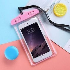 an iphone case sitting on top of a table next to a lemon and water bottle