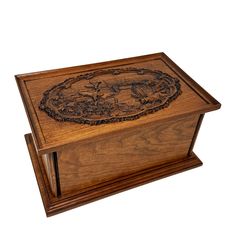 a wooden box with an intricate design on the lid