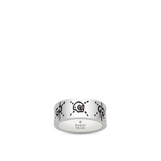 Gucci lets you have Halloween fun all year long with this ring from the Gucci Ghost collection. With a lustrous rhodium plating, this sterling silver band is inscribed with a skull with Gucci's double G hallmark as eyes, and more dripping double G's with stitched X's glamorize this ring as well. There is an unforgettable glow to this Gucci ring. Gucci Skull Ring, Gucci Ghost Ring, Ghost Collection, Ghost Ring, Gucci Ghost, Gucci Ring, Gucci Rings, Sterling Silver Rings Bands, A Skull