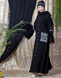 Easy to wear and handle Partywear abaya Classy and elegant Executive formal Abaya Elegant and trendy kaftan for every occasion Loose and elegant trendy fit to all Premium Shine Nida Fabric with rich look Hijab and band shown in the image can be bought separately Fabric: 100% Polyester Crepe ( Matt Finished Nida)Care: Mild machine wash/ hand Cold Wash/ Dry cleanWe request customers to carefully choose the correct size and dress length referring to our size chart Traditional Black Long Sleeve Khimar, Black Floor-length Abaya With Dabka Work, Modest Black Kaftan For Eid, Black Abaya With Dabka Work, Long Sleeve Dabka Abaya, Black Long Sleeve Khimar With Dabka, Festive Long Black Abaya, Embroidered Khimar For Eid, Black Embroidered Floor-length Abaya