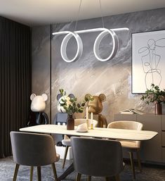 a dining room table with chairs and a teddy bear on the wall in front of it