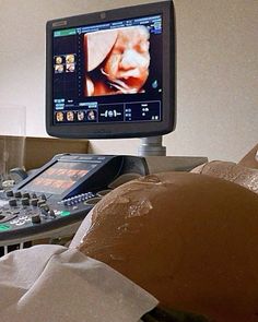 a computer monitor sitting on top of a desk