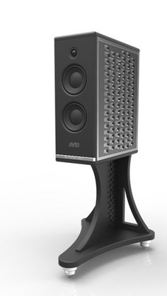 a black speaker sitting on top of a stand