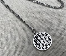 Here is a very cool and intricately detailed mandala pendant necklace.  It is simple yet stunning.  This would make the perfect everyday necklace for any stylish lady.  The pendant measures 3/4” long by 5/8” long.  Made from allergy free plated silver.  It hangs from a shiny strong 18” stainless steel necklace chain with a lobster clasp.I have matching earrings in my shop if you would like the whole set.  Here is a direct link........... https://etsy.me/2Y4edzoThanks for stopping by!  Please tak Bohemian Stainless Steel Nickel Free Necklaces, Bohemian Adjustable Stainless Steel Necklaces, Adjustable Bohemian Stainless Steel Necklaces, Nickel Free Circular Spiritual Necklace, Bohemian Hypoallergenic Necklace For Gift, Bohemian Hypoallergenic Necklace Gift, Hypoallergenic Bohemian Necklace Gift, Geometric Hypoallergenic Jewelry For Gifts, Detailed Mandala