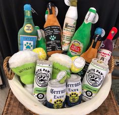 a basket filled with lots of different types of drinks and condiments on top of a table