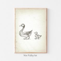 a black and white drawing of two ducks with one duckling in the foreground