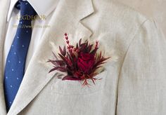 a suit jacket with a boutonniere on it