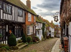 a cobblestone street lined with old buildings