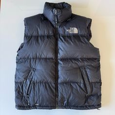 The North Face Nuptse Puffer Vest Men's Large 700 Goose Down Black Zip Item Is In Good Used Condition See Photos For Measurements You Can Find More Totally Rad Items Like This In My Poshmark Closet! The North Face Nupste Puffer Puff Vest Jacket Coat 700 Goose Down Fill Black Spell Out Logo Vintage Vtg Retro Rare Streetwear Ski Skiing Winter Fall Comfy Cozy Snow Snowboarding Skier Snowboarder Snowboard Rap Hip Hop Mom Dad Outdoor Outdoors Nature Hiking Camping Camp Walking Stowaway Stow Away Pack The North Face Hiking Outerwear With Pockets, Ski Vest, Cozy Snow, Puff Vest, North Face Nuptse, Nature Hiking, Nature Hikes, Vests Mens, Logo Vintage