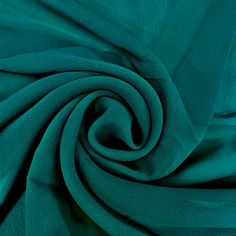 a close up shot of the fabric in teal green color, which is very soft