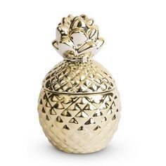 a gold pineapple shaped vase with an intricate design on the top and bottom is shown