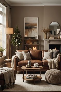 a living room filled with furniture and a fire place in front of a large window