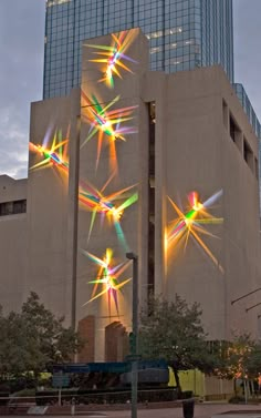 a large building with many lights on it's side