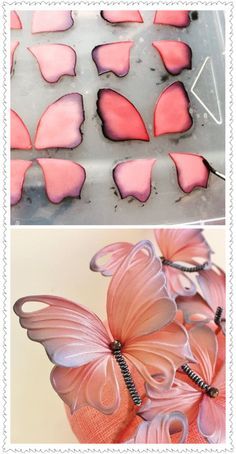 pink butterflies are sitting on top of each other in the shape of heart shaped cookies