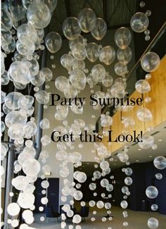 the words party surprise get this look are in front of bubbles floating from a ceiling