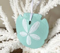 a ceramic ornament with a dragonfly on it