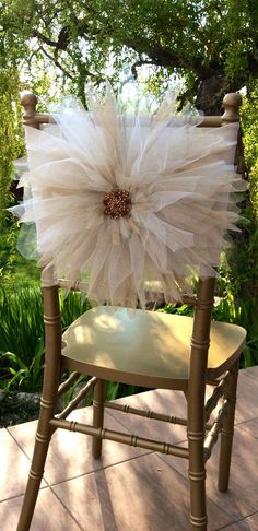 a chair with a flower on the back