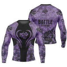 a purple and black long sleeved shirt with flowers on the chest, in front of it