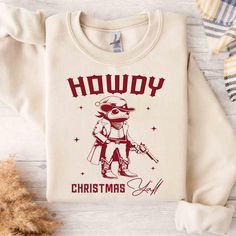 Howdy Christmas Yall Sweatshirt, Western Christmas Sweatshirt, Cowboy Xmas Gift, Country Christmas Gift, Cowgirl Tee, Horse Christmas Shirt ------------------------------  INFORMATION  - If you want to print the side, there will be an additional fee for printing the back side. - If you want a custom design, please message us or you can write it in the personalized box.  - If you want the standard size and color of the shirts, please message us. We will help you understand better. ** How to order? ** 1. Please check all the pictures and choose your T-shirt Size and Color. 2. Choose any quantity. 3. Please enter Custom Design Color and Personalized Box (if any) 4. After you add notes, please Click "Proceed to Checkout" After selecting the order, please check the address and parameters again. Frog Christmas, Etsy Shirts, Sweatshirt Western, Christmas Pjs Family, Christmas Horse, Horse Christmas, Christmas Horses, Corpus Christi Tx, Christmas Pjs