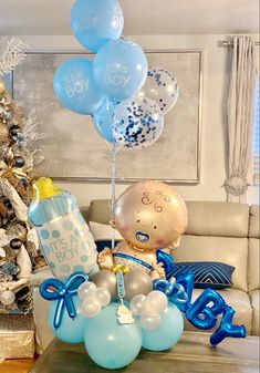 a baby's 1st birthday centerpiece with balloons