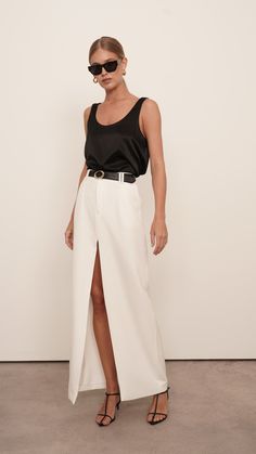 The luxury silk Isola Cami is a wardrobe staple. Constructed from high-quality silk for a relaxed fit, it adds a touch of elegance to any outfit. Perfect for day-to-night dressing, it will become a go-to piece. Styled with our Gretta pants. 100% Silk Dry Clean only White Silk Top Outfit, White Silk Maxi Skirt, Silk Cami Outfit, Silk Pants Outfit, Linen Skirt Outfit, Silk Top Outfit, Silk Shirt Outfit, Silk Skirt Outfit, White Silk Top