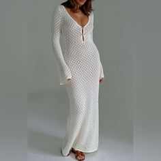 Beautiful Crochet Maxi Dress Flare Long Sleeves V-Neckline Front Deep Rounded V Back Two Keyhole Front Centre Cut-Outs Fastened W Metal Bar Hardware Extra Bling See-Through Mesh-Like Fabric For Comfort Statement Sleeve & Floor-Sweeping Hem Add Drama W/O Looking Overdone Cute & Versatile Cover Up For Pool, Beach, Vacation, Brides, Bachelorettes Wear Casually On Sunny Day/Dress Up W Heels New Perfect Condition Multiple Sizes Dimensions Last Pic Small (4) Medium (6) Large 8 / 10 Cutout Knit Long Go Long Sleeve Crochet Dress, Bar Hardware, Long Fitted Dresses, Aesthetic Clothing Stores, Sweater Maxi Dress, White Flares, Crochet Maxi Dress, Long Beach Dress, Flare Long Sleeve