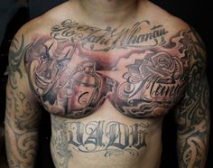 a man with some tattoos on his chest