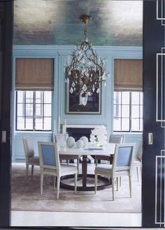 an open door leading to a formal dining room