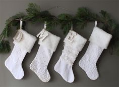 three christmas stockings hanging on a wall