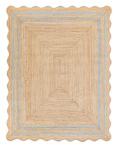 an area rug with scalloped edges in beige and blue