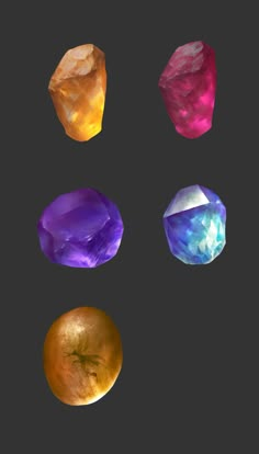 four different colored stones on a black background