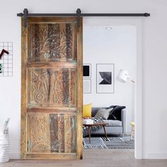 an open wooden door in a living room