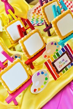 there are many small frames on the table for children's birthdays to enjoy