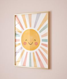 a yellow sun with a smiling face on it's side hangs above a pink wall